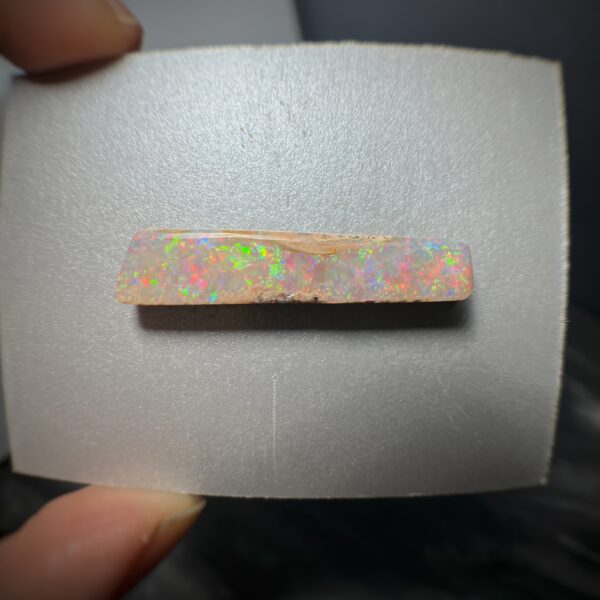 Large Rainbow Pipe Boulder Opal 10.85ct side angle photo